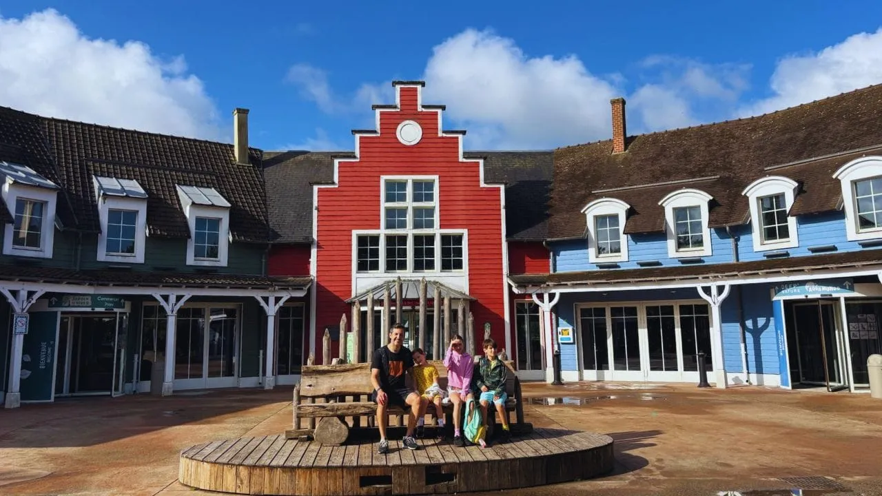 Our family outside the red-gabled market square buildings at Center Parcs Le Lac d’Ailette